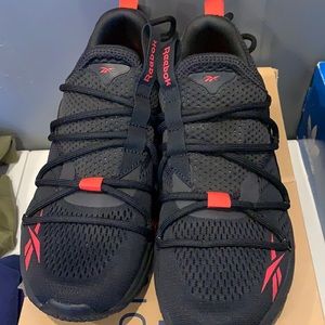 Black Red Reebok sneakers with a hint of yellow